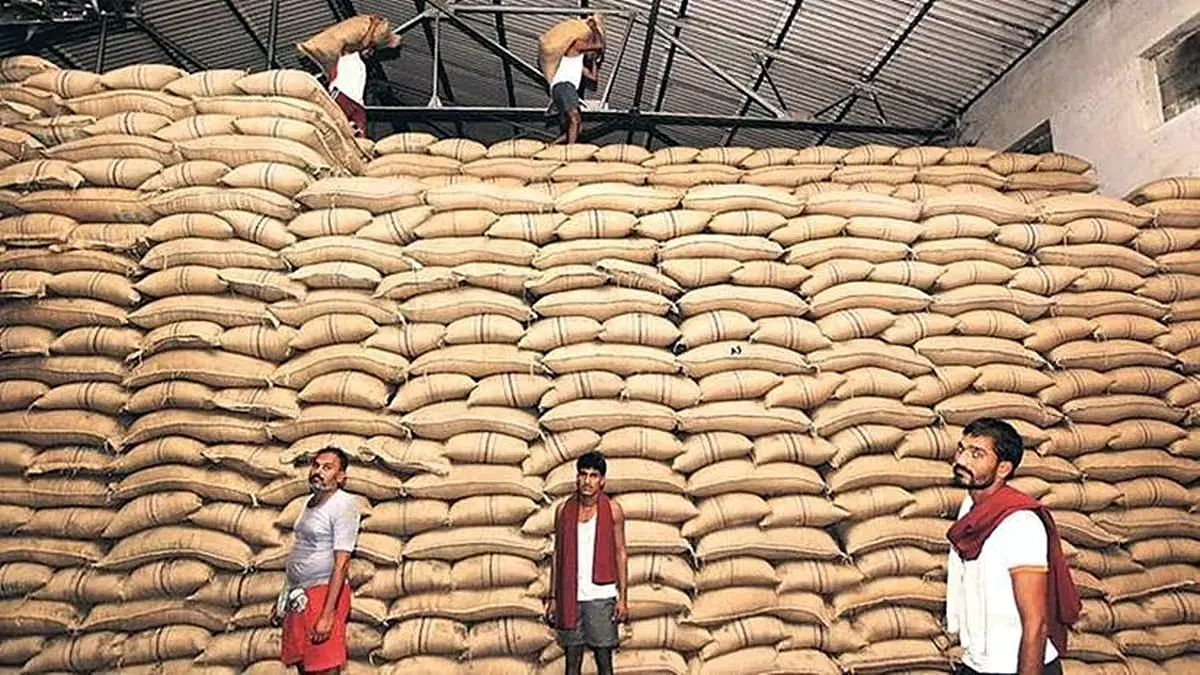 Large stacks of paddy bags stored in a foodgrain warehouse in India